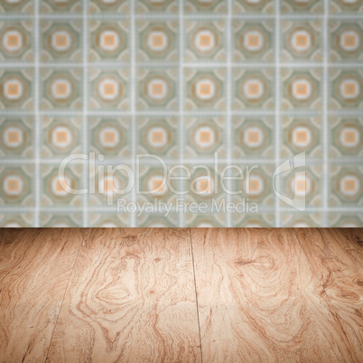 Wood table top and blur vintage ceramic tile pattern wall