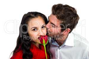 Man kissing his girlfriend