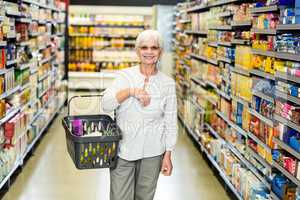 Smiling senior woman with basket