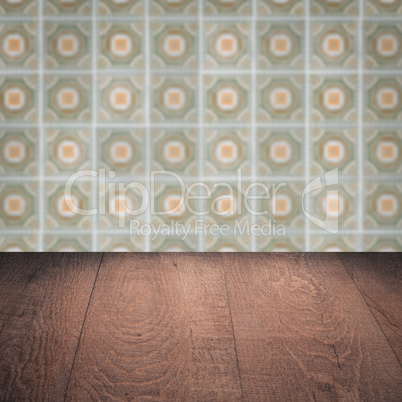 Wood table top and blur vintage ceramic tile pattern wall