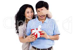 Smiling woman giving her partner a present