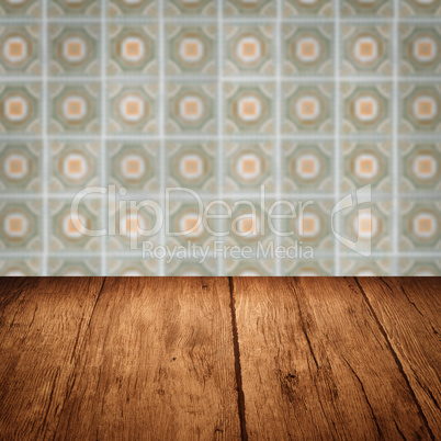 Wood table top and blur vintage ceramic tile pattern wall Wood table top and blur vintage ceramic tile pattern wall