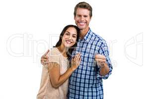Portrait of happy couple with keys