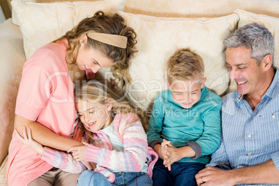 Happy family resting on the sofa