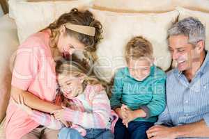 Happy family resting on the sofa