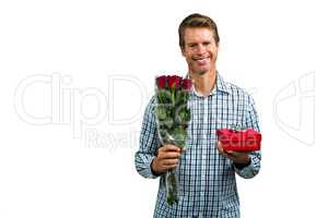Smiling man holding bouquet of roses