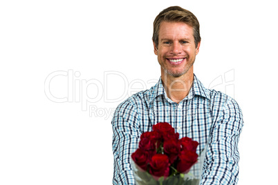 Smiling man with bouquet of roses