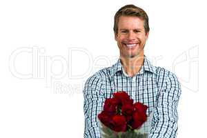 Smiling man with bouquet of roses