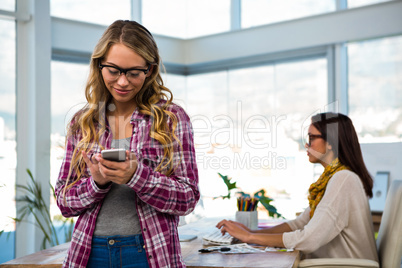 Two girls work at office