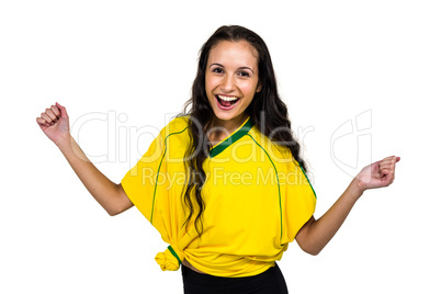Smiling woman with hands clasped