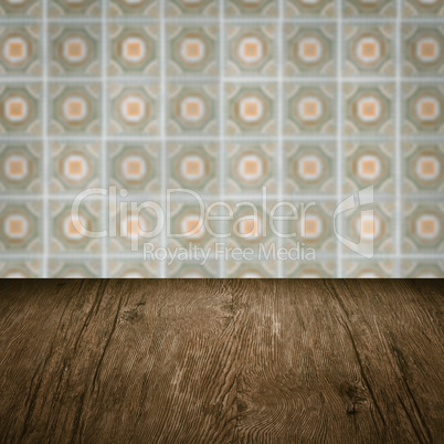 Wood table top and blur vintage ceramic tile pattern wall