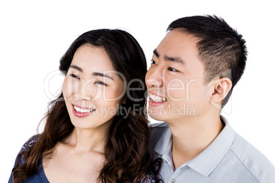 Cheerful couple looking away