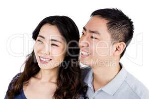 Cheerful couple looking away