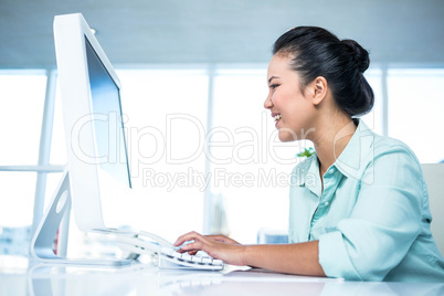 Businesswoman typing on her computer