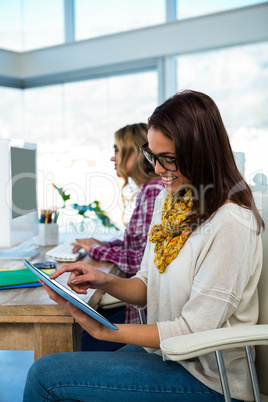 Two girls work at office