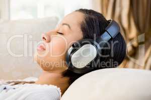 Relaxed brunette with headphones