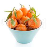 Tangerines on ceramic blue bowl