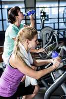 Fit women doing exercise bike