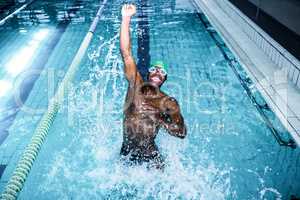 Fit man diving in the swimming pool