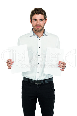 Standing man showing white papers