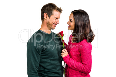 Smiling couple with red rose