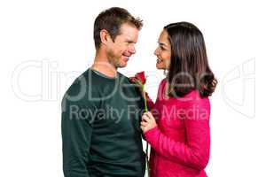 Smiling couple with red rose