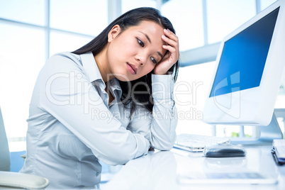 Thoughtful businesswoman with hand on face