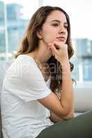 Woman thinking with hand on chin