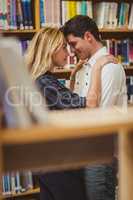 Couple with books looking at each other