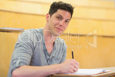 Smiling male student during class