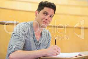 Smiling male student during class