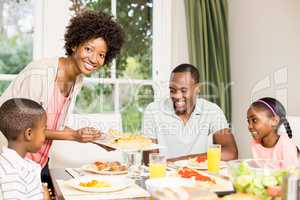 Happy family eating together