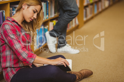 Female student working on floor