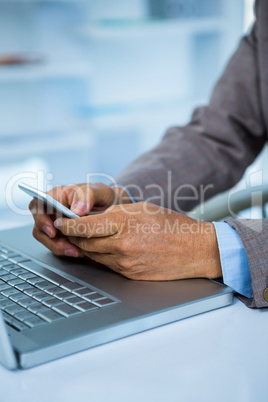 Businessman on his smartphone