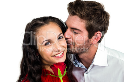 Smiling couple holding rose