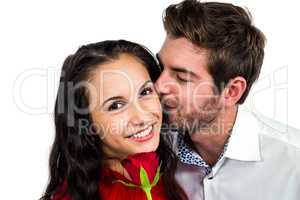 Smiling couple holding rose