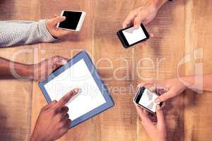 Business people using technologies at desk