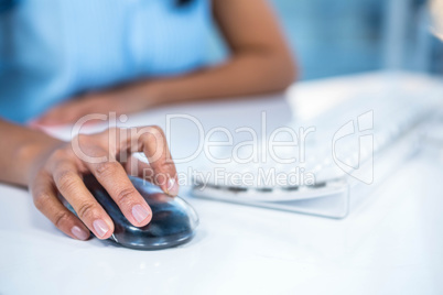 Cropped image of businesswoman using mouse