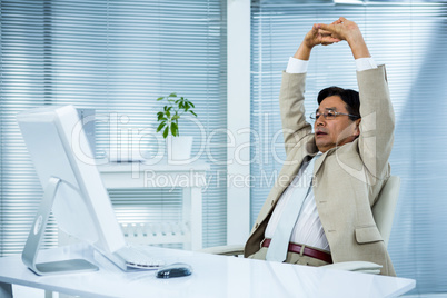 Businessman stretching his arms