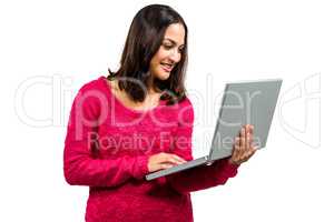 Happy pretty woman using laptop