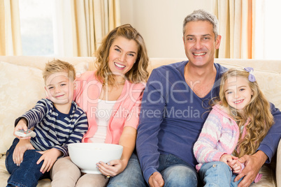 Happy family enjoying a movie together