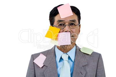 Businessman with blank note over his face