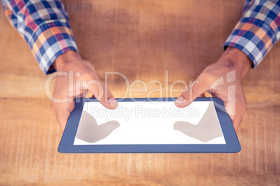 Cropped image of hands using tablet PC