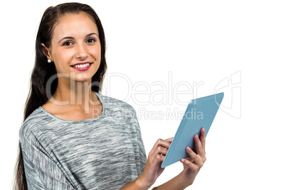 Smiling woman using digital tablet