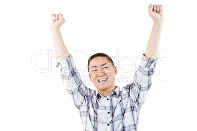 Portrait of cheerful man with arms raised