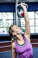 Portrait of woman holding kettlebell