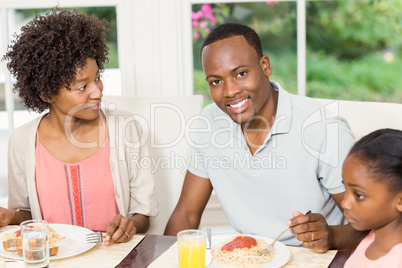 Happy family enjoying their meal