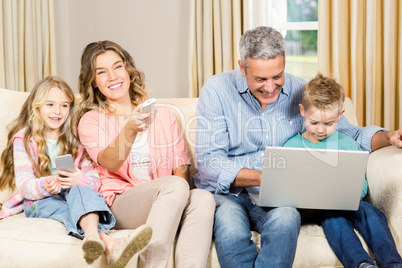 Happy family enjoying a movie together