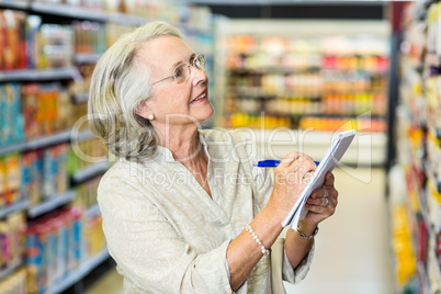 Senior woman checking list