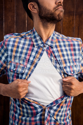 Male professional pulling his shirt like superhero